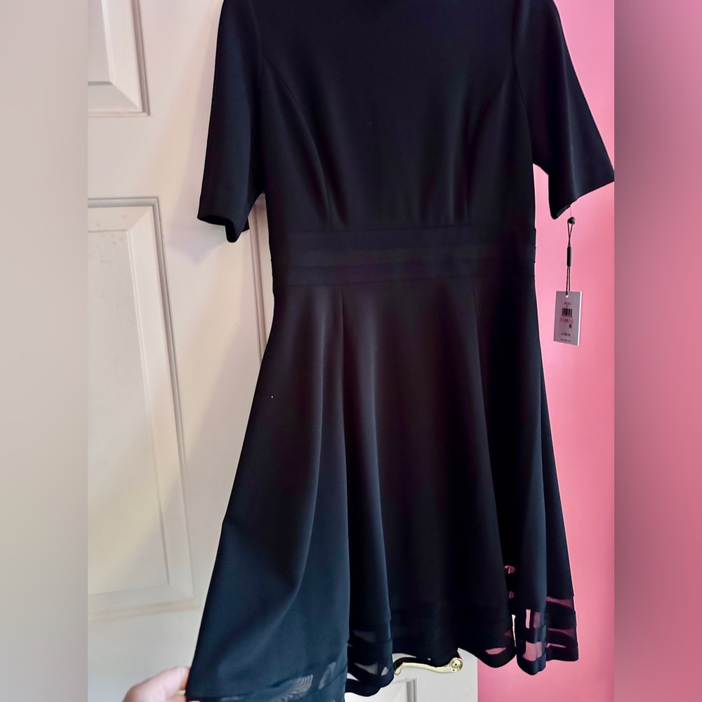 W/tags, never worn classic black, slightly a-line skirt dress